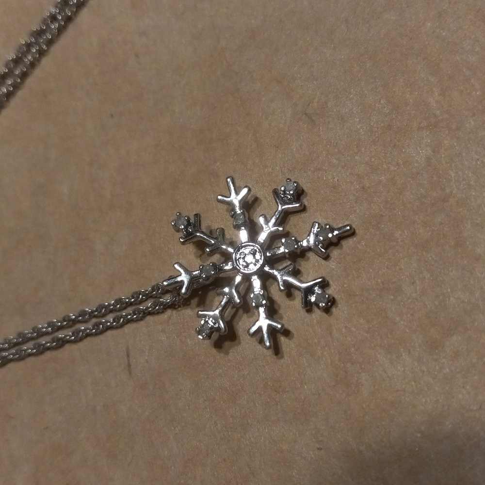 Dainty snowflake necklace with stones, labeled turkey